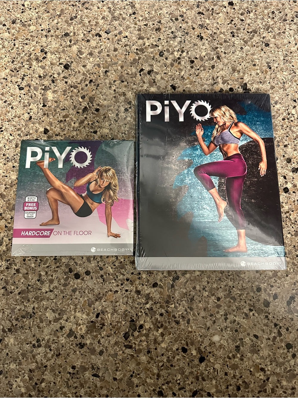 Beachbody PiYo DVDs with Pink and Teal Artwork